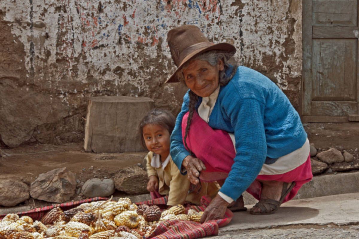 Woman selling corn in Peru