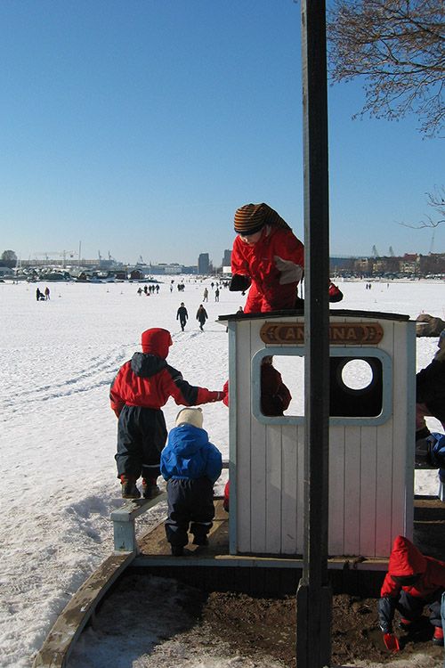 Boat on frozen sea in Helsinki, Finland